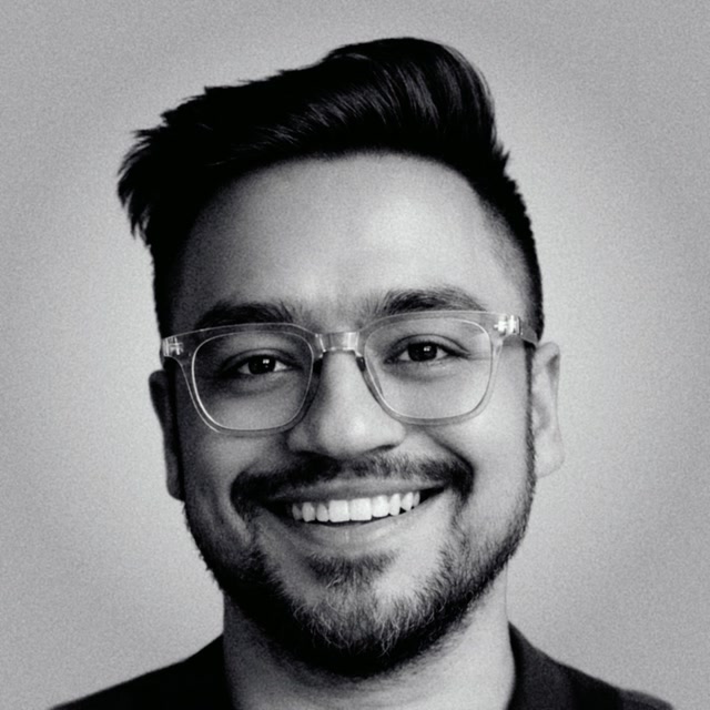Fahad Ahmed, author at Eddie AI, smiling and wearing clear glasses.